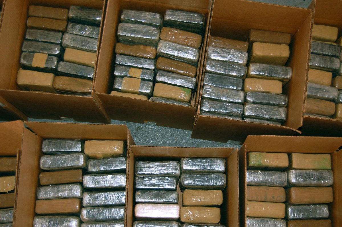 Boxes of seized narcotics awaiting inventory as evidence following a federal drug bust